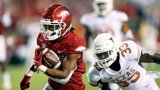 Arkansas Razorbacks running back AJ Green (0) rushes for a touchdown in the second half against the Texas Longhorns at Donald W. Reynolds Razorback Stadium. Arkansas won 40-21.